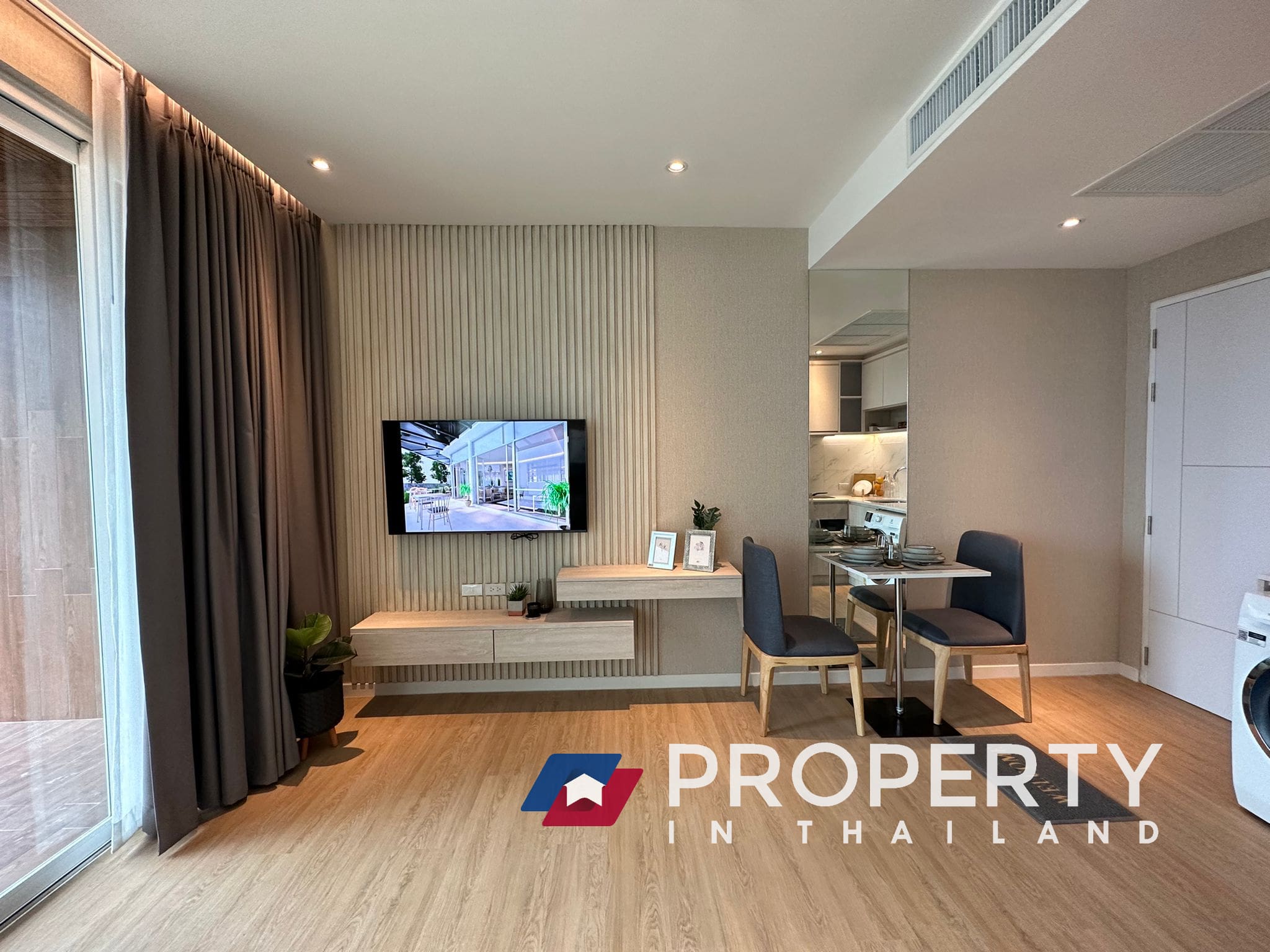 Thailand Property for sale in Beachfront Bliss (LIvingroom with TV and chairs)